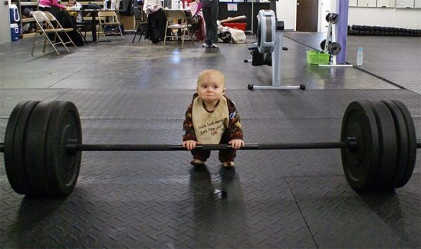 People at the gym are doing everything except working out